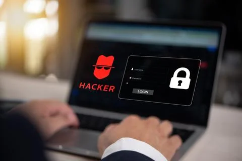 Cybersecurity concept with hacker icon and login screen on laptop Stock Photos