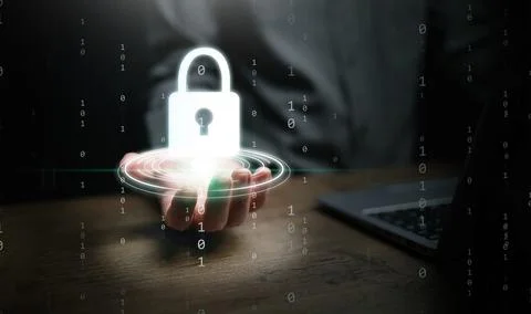 Cybersecurity concept. A man hand next to computer laptop in his office hol.. Stock Photos