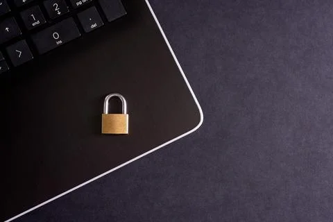 Cybersecurity concept, padlock on laptop computer keyboard Stock Photos