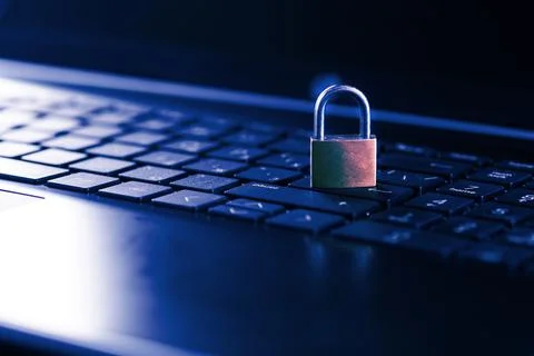 Cybersecurity concept, padlock on laptop computer keyboard Stock Photos