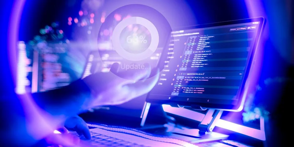 Cybersecurity concept. Programmer updates software, system upgrade Stock Photos
