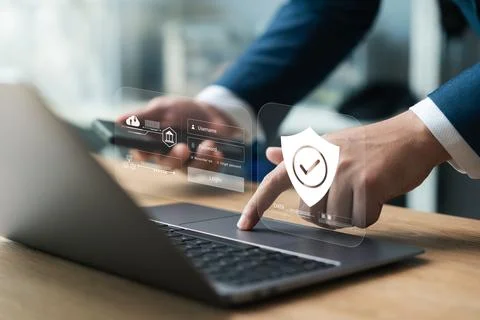 Cybersecurity data protection, businessman using laptop and smartphone inte.. Stock Photos