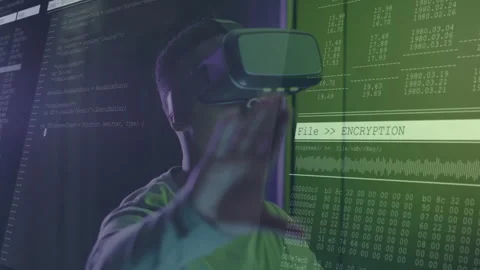 Cybersecurity developer using VR headset in tech lab, navigating code and Stock Footage 309105842