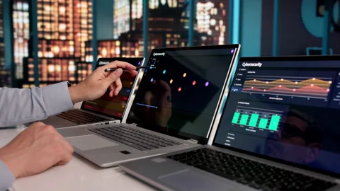 Cybersecurity Engineer Carefully Monitors Computer Network Stock Footage 333398745