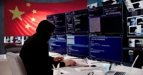 Cybersecurity Expert Coding With Chinese Flag Displayed In Background Stock-Fotos