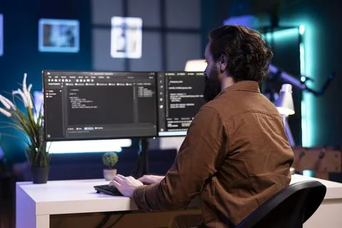 Cybersecurity expert using computer to look for company security vulnerabilities Stock Photos