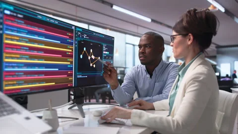 Cybersecurity Experts Analyze Threat Data Together Stock Footage 343881711