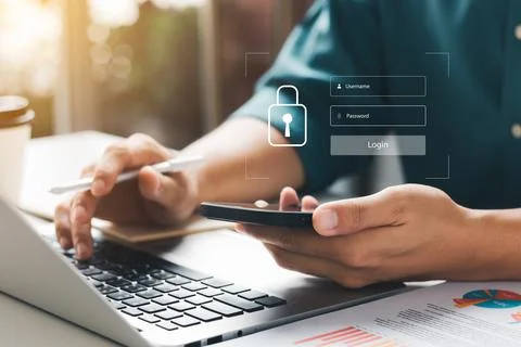 Cybersecurity internet and networking concept. Close up of hand holding smart Foto stock