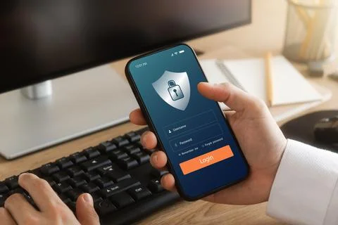 Cybersecurity internet and networking concept. hand holding smartphone inform Stock Photos