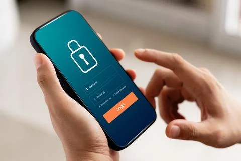 Cybersecurity internet and networking concept. Close up of hand holding sma.. Stock Photos
