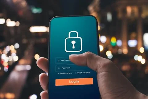 Cybersecurity internet and networking concept. Close up of hand holding sma.. Stock Photos