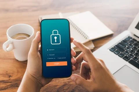Cybersecurity internet and networking concept. Close up of hand holding sma.. Stock Photos