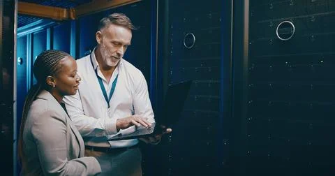 Cybersecurity, laptop and problem solving with people in server room together Stock Photos