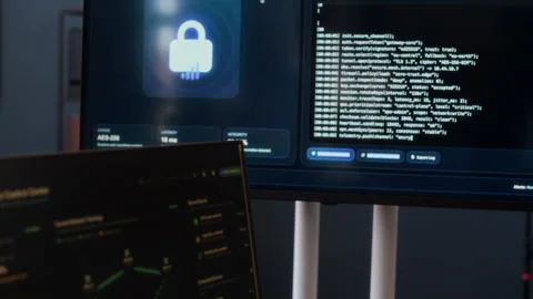 Cybersecurity Monitoring System with Programming Codes on Screens in Office 動画素材 334928299