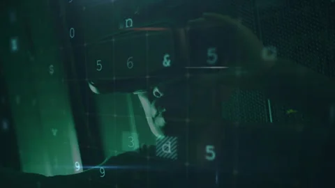 Cybersecurity specialist scanning code in green room, detecting malware and Stock Footage 310430660