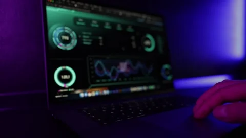 Cybersecurity Specialist Working on Laptop with statistics and Analytics in Stock Footage 336545661