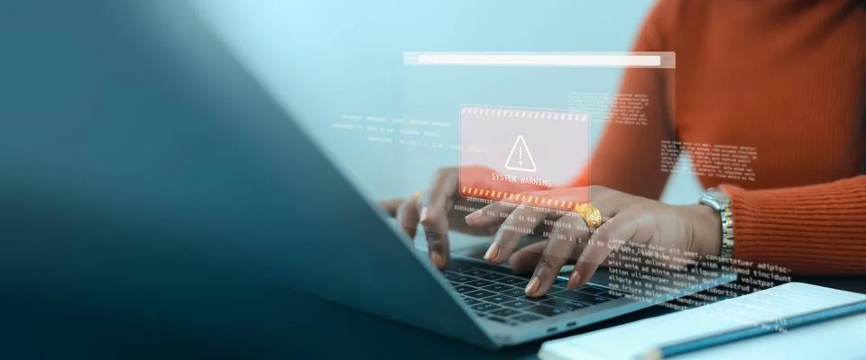 Cybersecurity system warning with computer laptop and businesswoman hands t.. Stock Photos