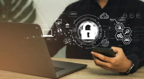 Cybersecurity technology concept Businessman using laptop and smartphone Stock-Fotos