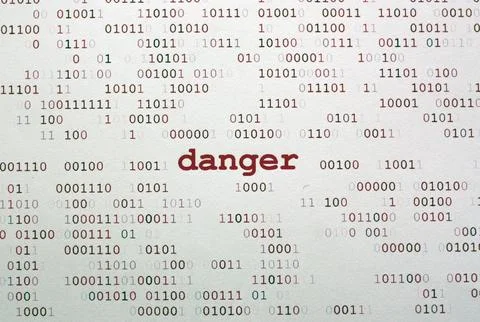 Cybersecurity Threat Concept with Binary Code and Danger Warning Text 写真素材