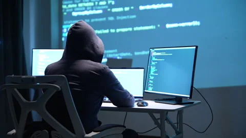 Cybersecurity Threat: Hacker Analyzing Code on Multiple Monitors Stock Footage 336678955