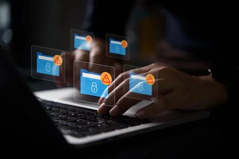Cybersecurity warning on data folders with lock icons and red warning alert.. Stock Photos
