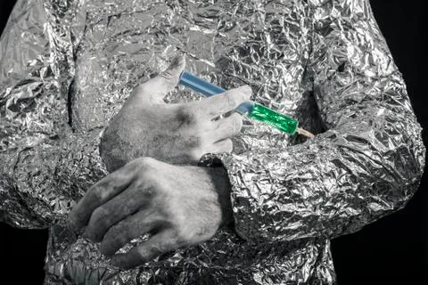 Cyborg applying syringe Stock Photos