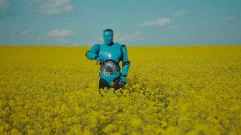 Cyborg performing a funky dance on yellow flower field. Funny cybernetic Video stock 133294985