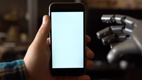 Cyborg uses the phone. Gray mechanical hand swipe down on smartphone with white Stock Footage 126862684
