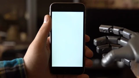 Cyborg uses the phone. Gray mechanical hand swipe right on smartphone with white Stock Footage 126862980