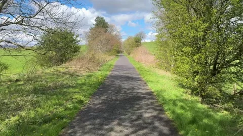 Cycle and walk path in countryside built on old railway line Stock Footage 273998845
