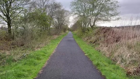 Cycle and walk path in countryside built on old railway line Stock Footage 274163159