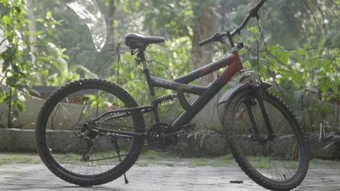 Cycle being washed with water slow motion  washing bicycle kids Video stock 129846752