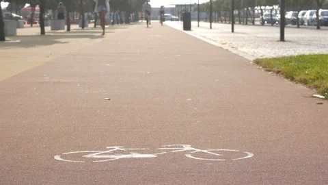 Cycle lane, low angle shot as cyclists ride past Stock Footage 111839724