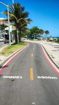 Cycle path on the beach on a beautiful sunny day. Stock Photos