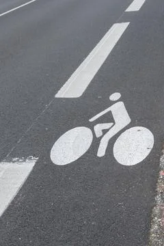 Cycle path with line protect painted on the asphalt road floor Stock Photos