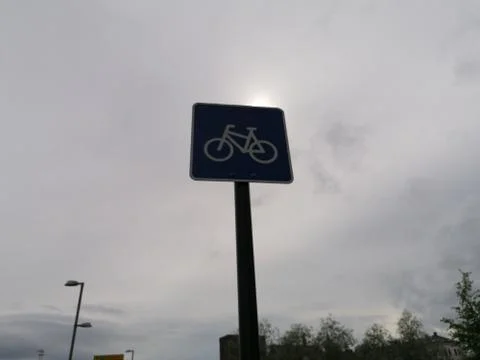 Cycle path sign in the gray depressing weather Stock Photos