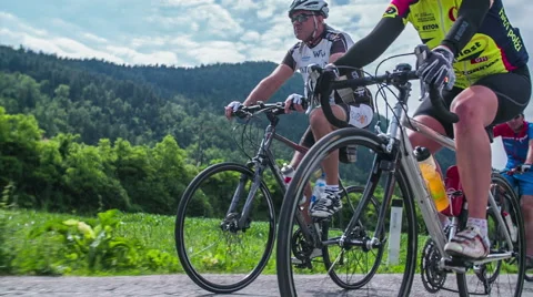 Cycle race competitors low angle slow motion Stock Footage 40053126