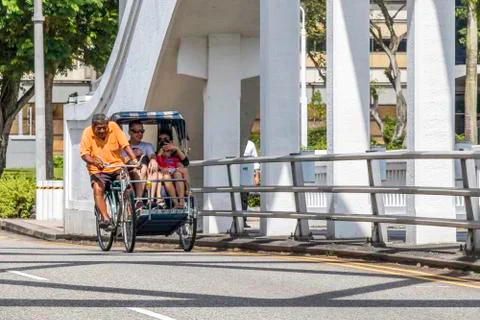 Cycle rickshaw with passengers Foto stock