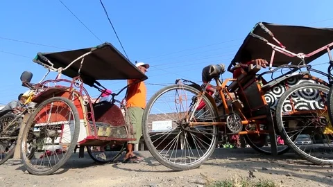 Cycle Rickshaws Standing On The Roadside In Indonesia Stock Footage 85281007