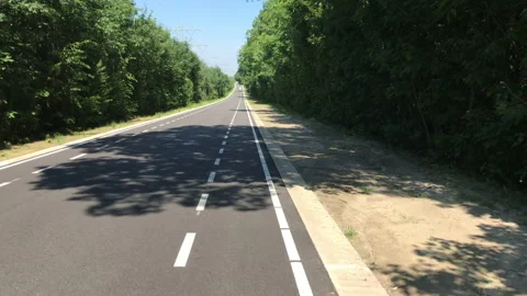 Cycling along the Grensweg border between the two countries. The road is in The 動画素材 135252745