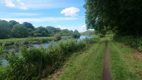 Cycling along the towpath on the Barrow river Kilkenny Stock Footage 236533217