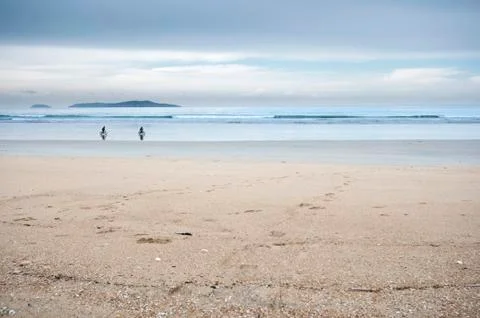 Cycling on beach Foto stock