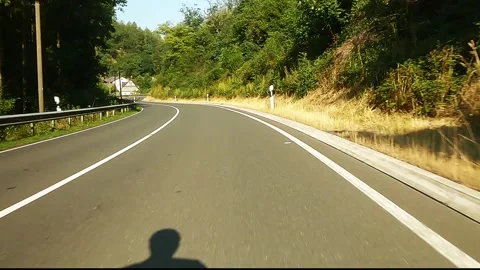 Cycling  on empty road Video stock 267128662