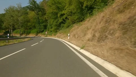 Cycling on empty road at summer Video stock 267128782