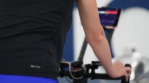 Cycling female Athlete doing testing in modern high-tech Sport Science lab Stock Footage 114017862