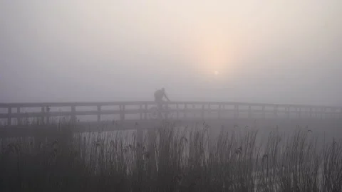 Cycling in the fog Stock Footage 133058409