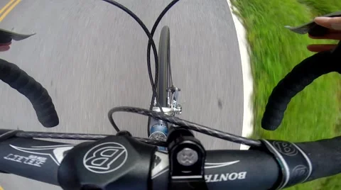 Cycling handle bar shooting down to front tire Stock Footage 40732587