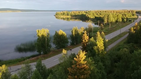 Cycling by the lake Stock Footage 114983153