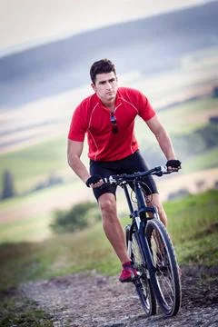 Cycling man young man cycling Cross-country (License=RF) 4379980 ,model re... Stock Photos