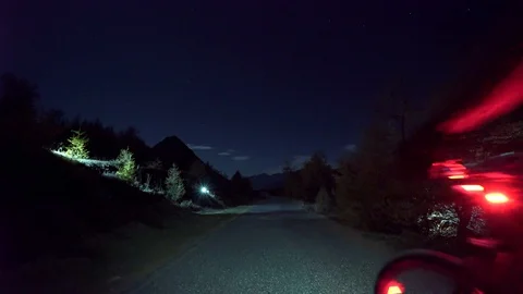Cycling at night with colored lights in the mountain 스톡 동영상 128733985